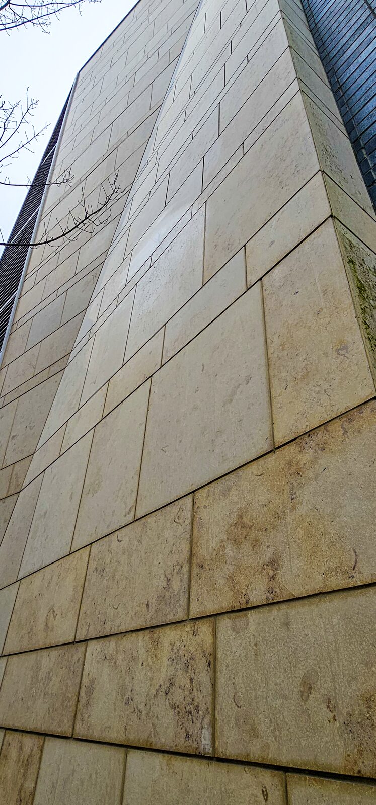 Tall limestone corner of the Anvil Centre