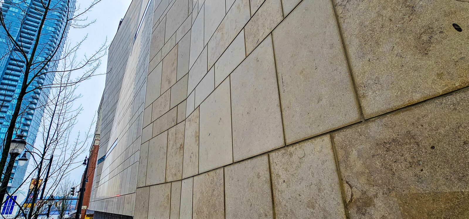 Curved limestone elevation seen from below