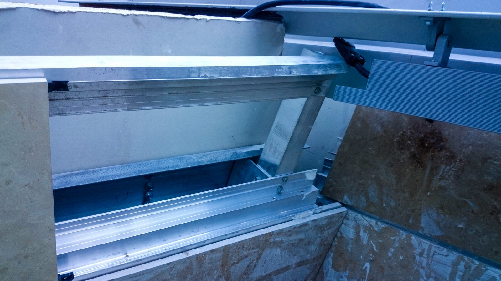Anchor bracket close-up above a set panel