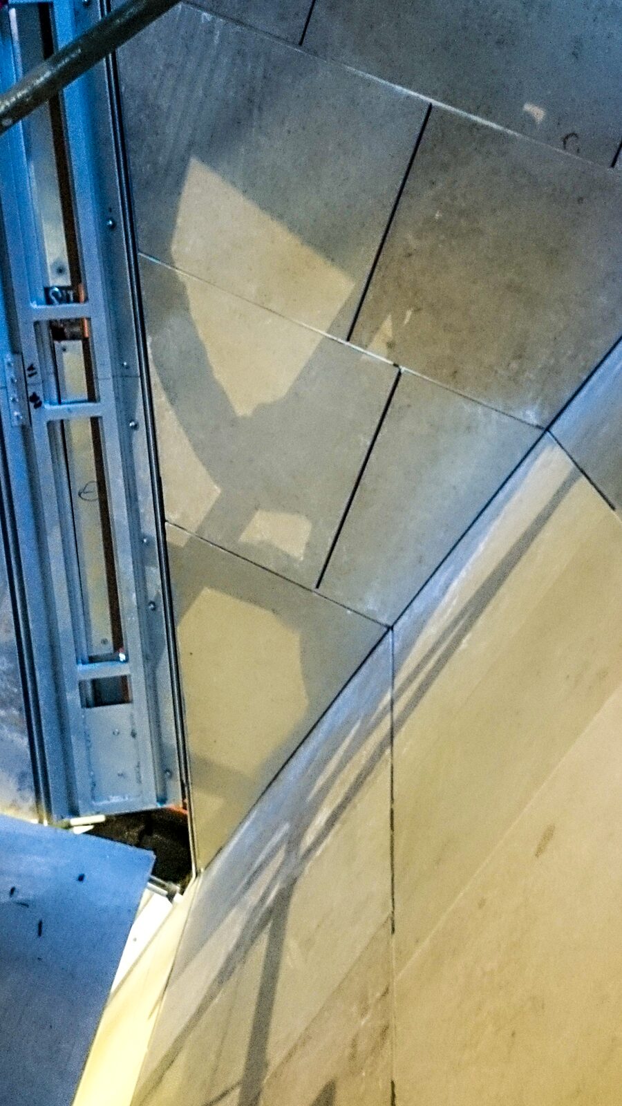 Sloped corner panel with the anchor system exposed