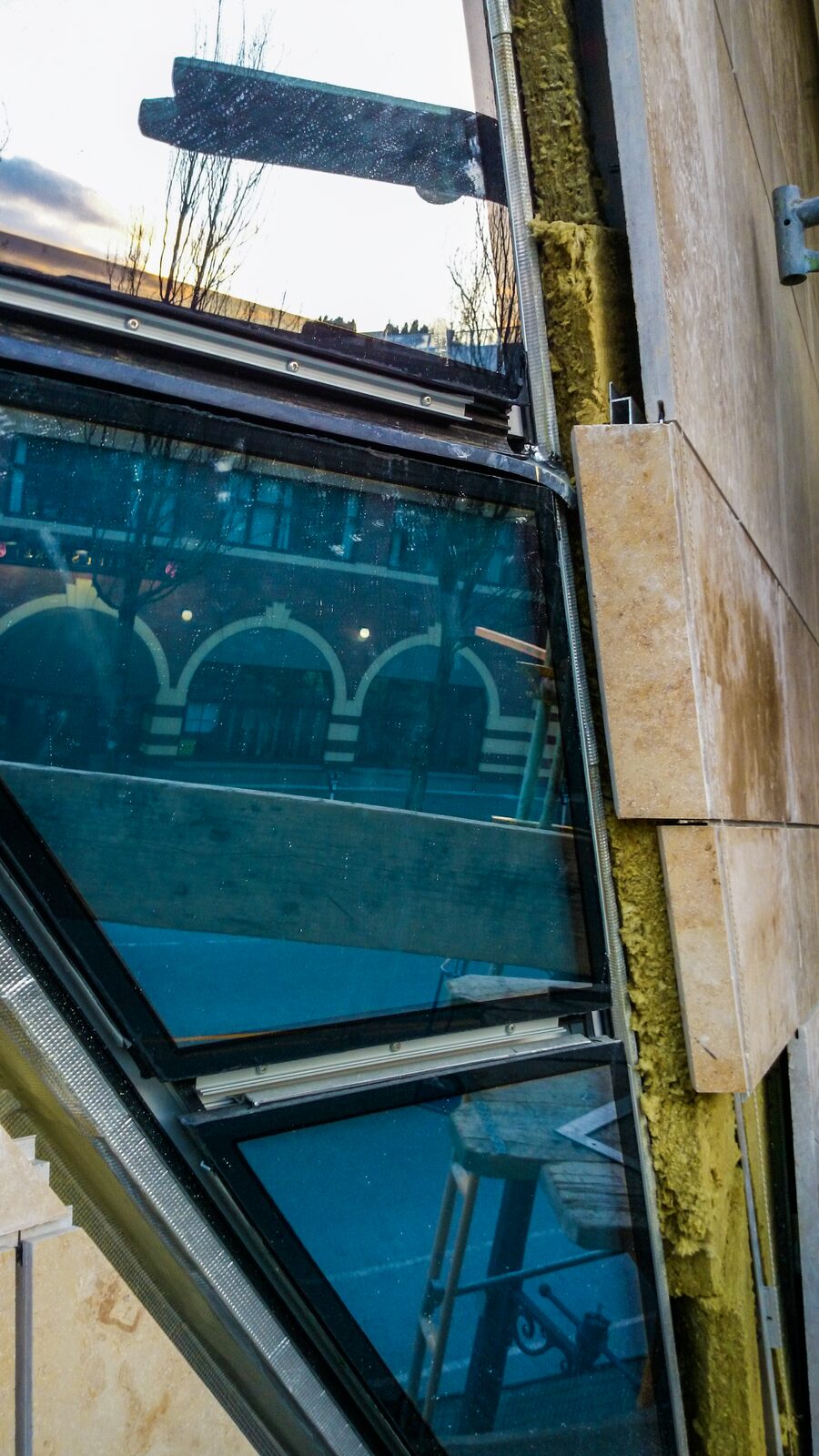 Stone-to-window junction detail on the facade