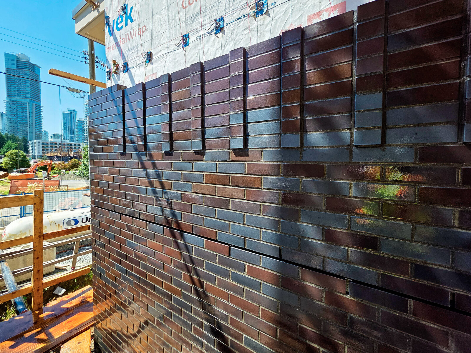 Charcoal brick elevation at Botanica